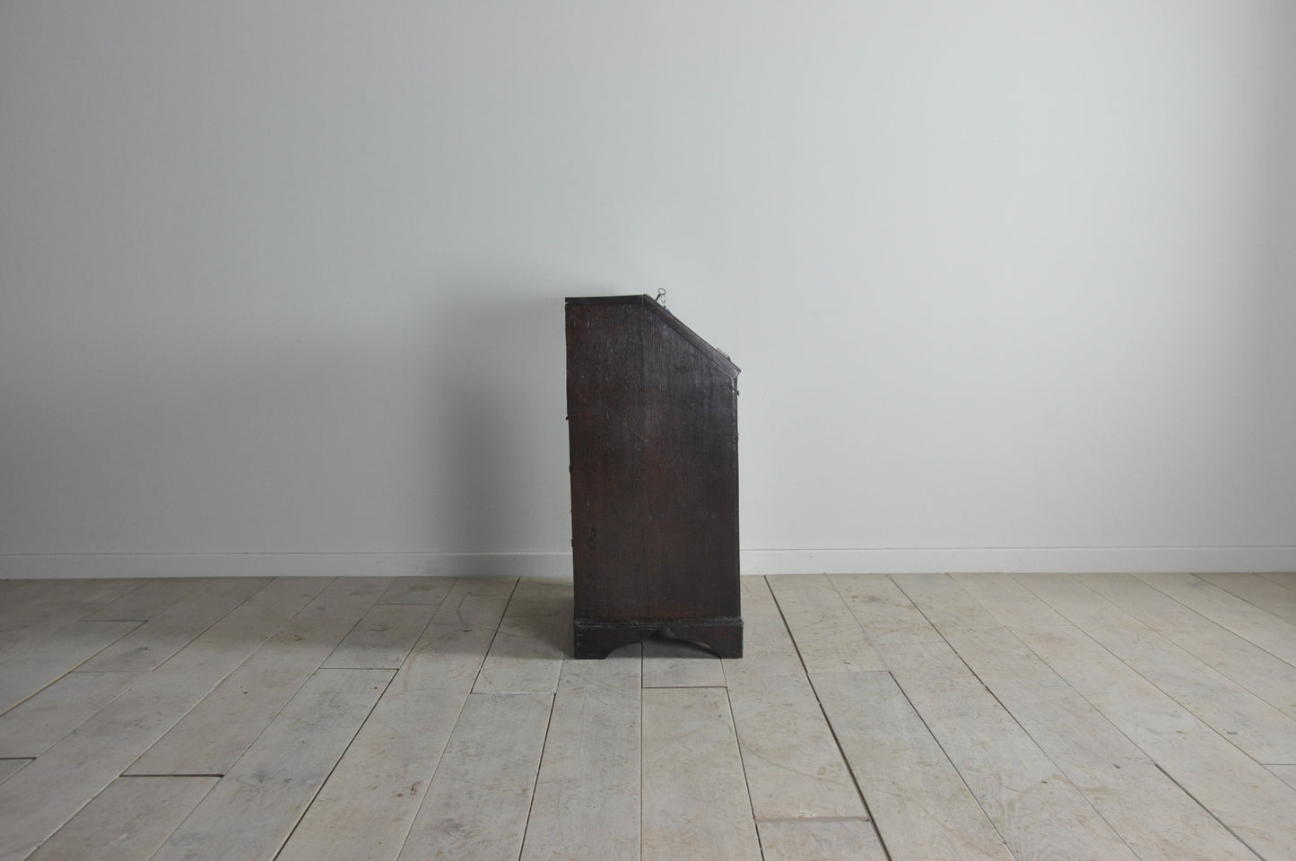 Early oak bureau with well and secret drawer