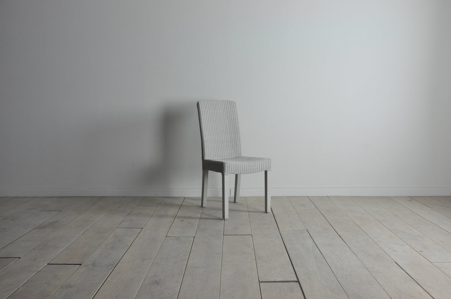 Neptune Montague Lloyd Loom dining chair in pale stone