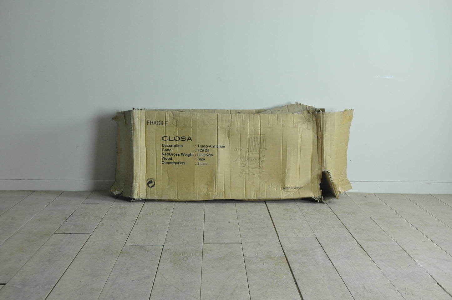 Folding teak armchair