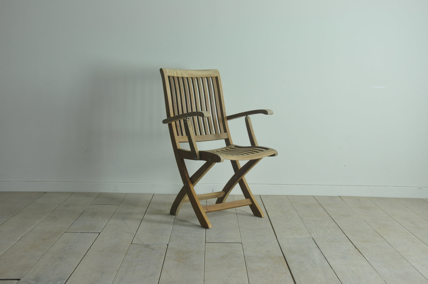 Folding teak armchair