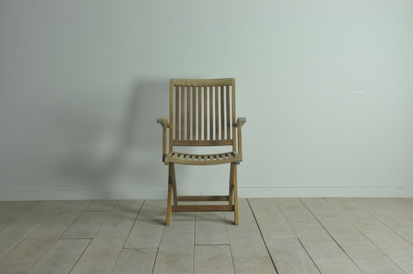 Folding teak armchair
