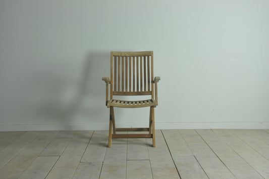 Folding teak armchair