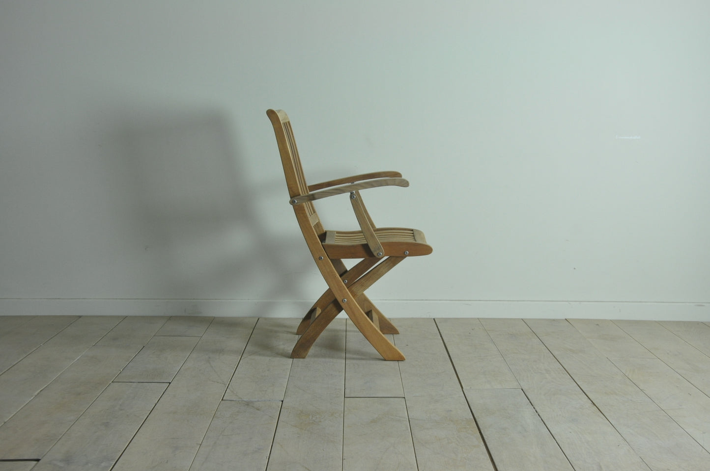 Folding teak armchair