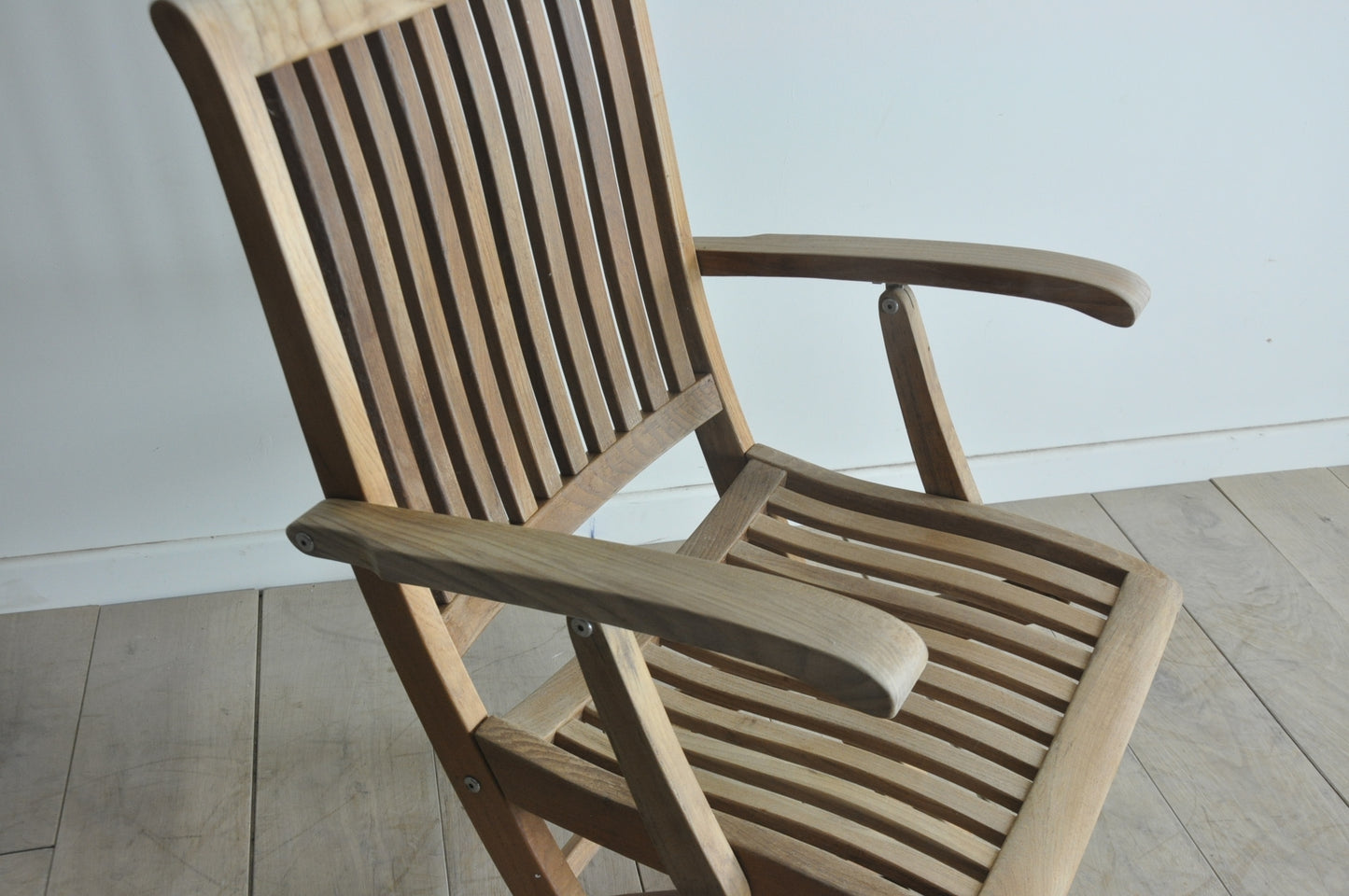 Folding teak armchair